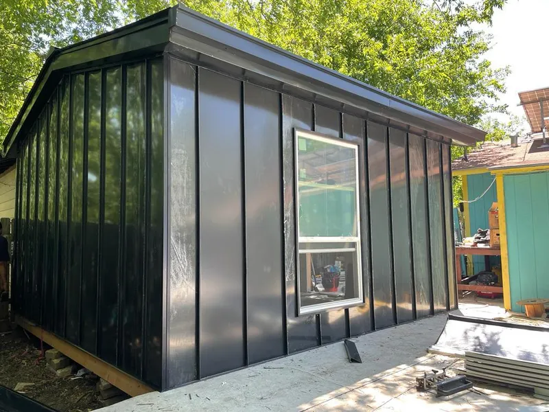 Black standing seam metal wall panels for Roof Inspection in Oakwood